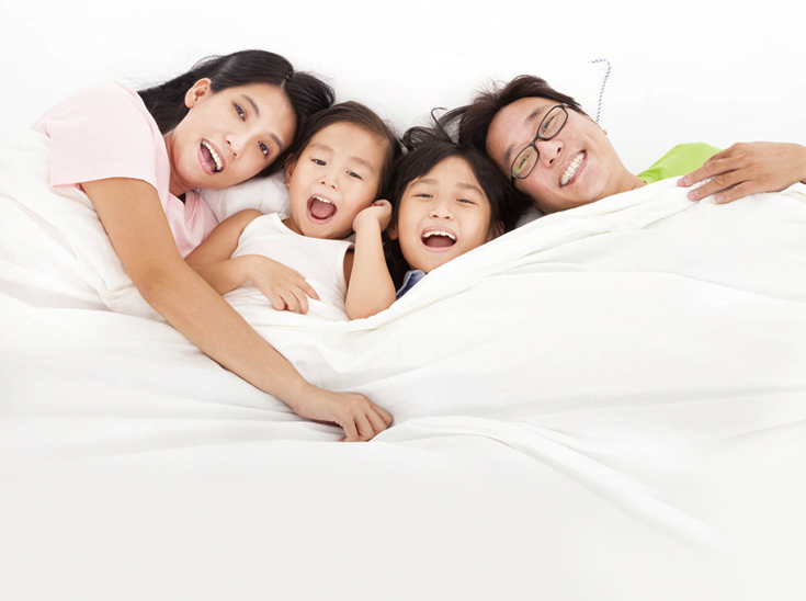 Happy   family on the bed